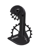 Kogel Speed Kolossos Pulsar oversized derailleur cage in anodized black, three-quarter view with the Pulsar icon etched on the lower chain guard