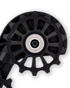 Close up of the Kolossos Pulsar full ceramic bearing seated in the oversized pulley wheel